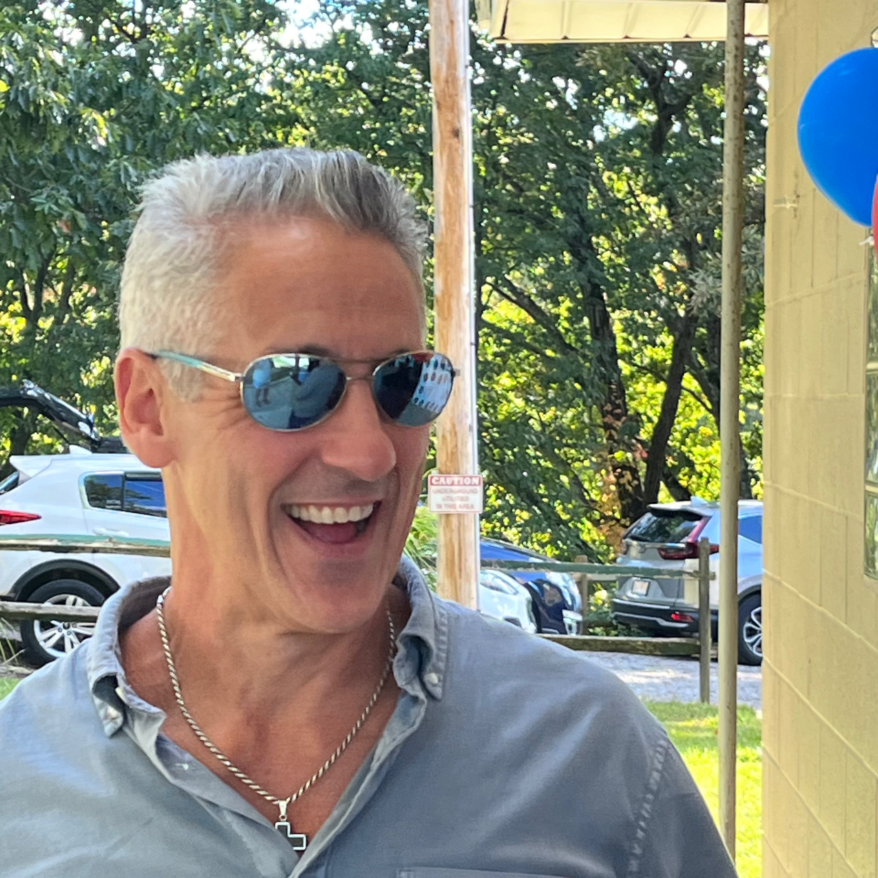 handsome man with narrow-face wearing hook optics polarized sunglasses with high-performance optics