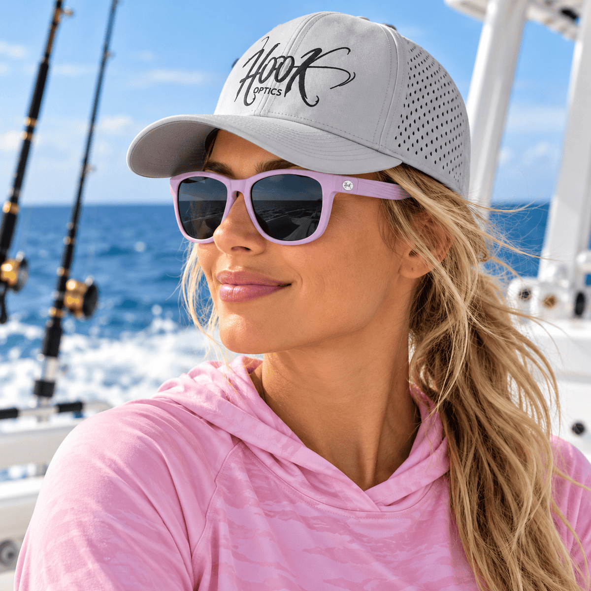 pretty lady angler wearing pink hook optics sunglasses